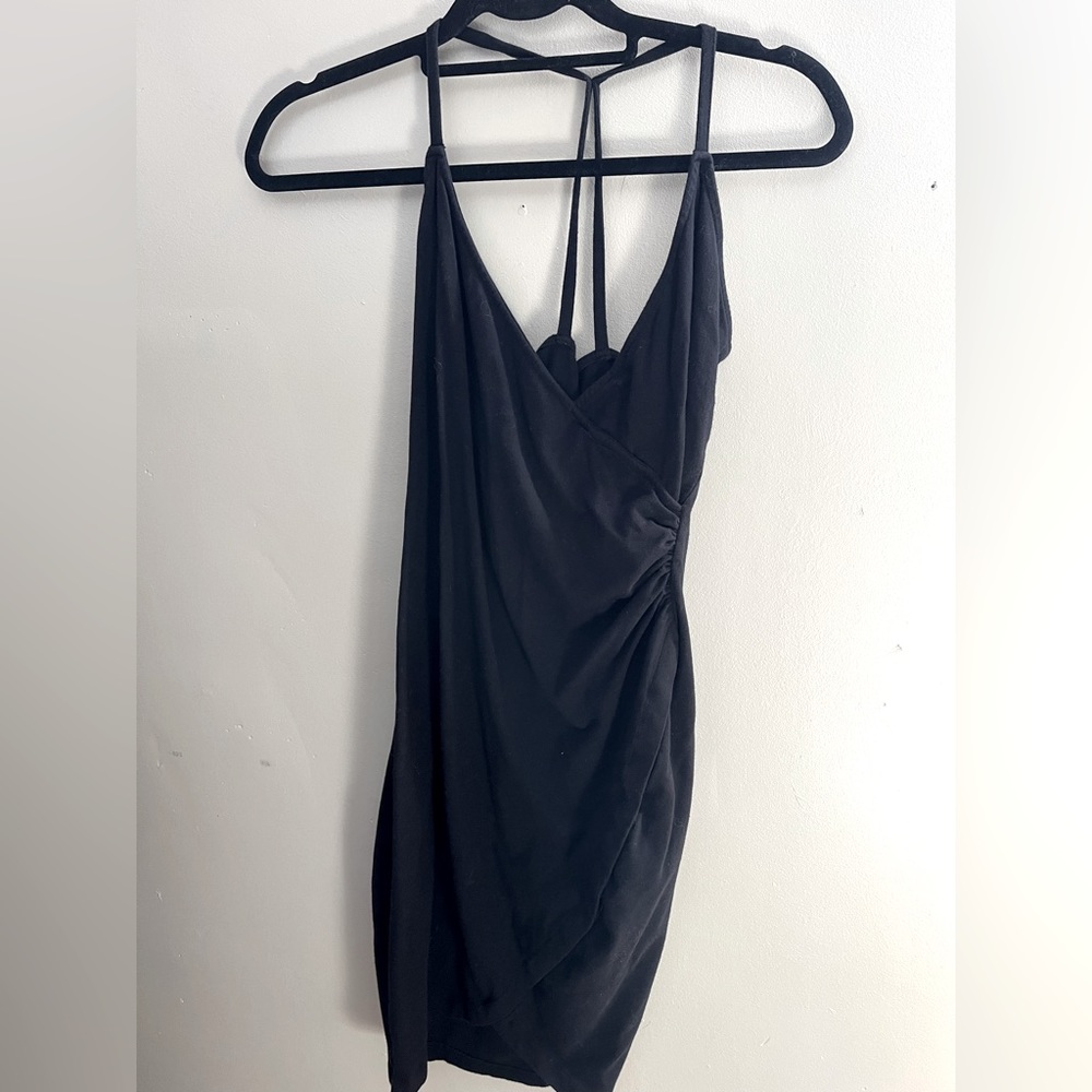 Heading to Paris this summer? Perfect little black dress. Stretchy form fitting